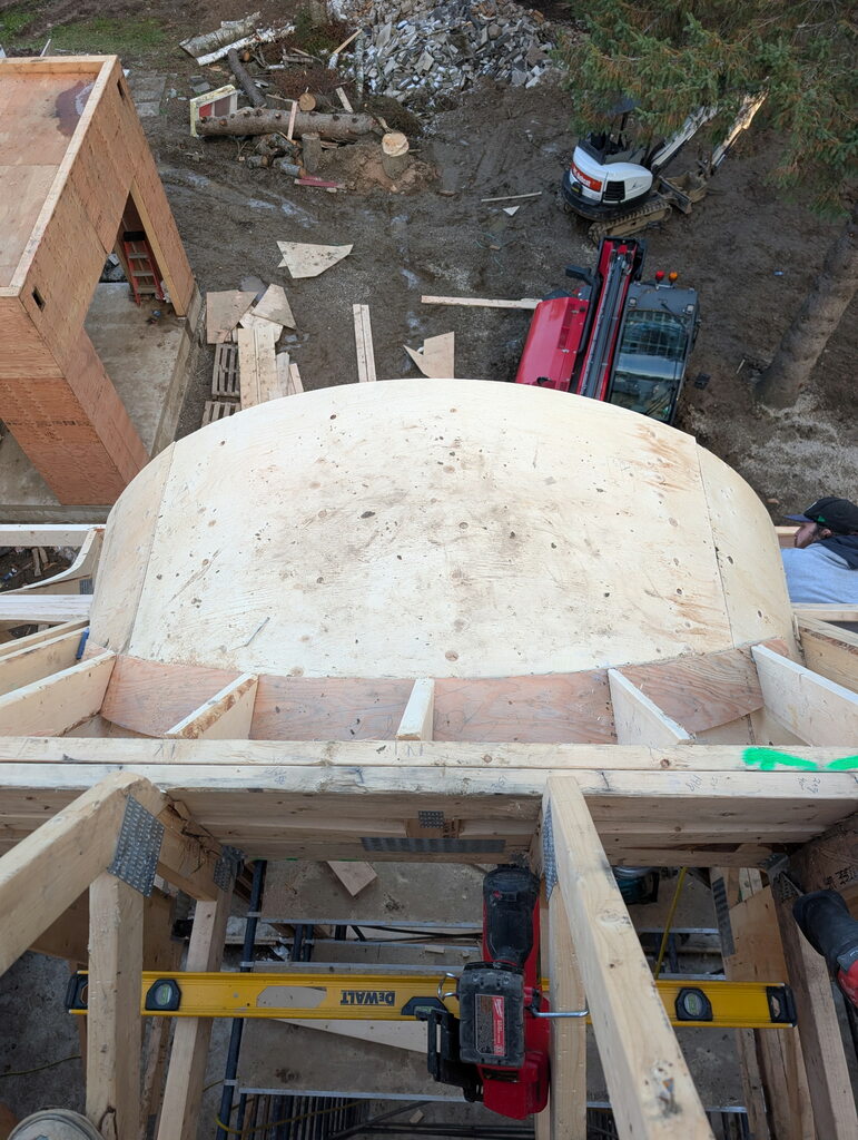 looking down overtop a barrer dormer on a pitched roof