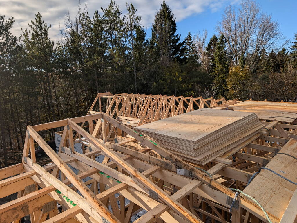 Sheets of ply are ready for nailing down to the roof framing