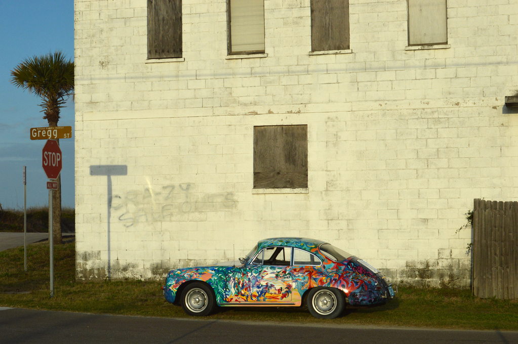 A Porsche 356 painted expressionistically in beautiful pastel colors. This art car is called Hatha Petey and was painted by Margaret Warren. It is shown here in late afternoon light at Amelia Island, Florida. 